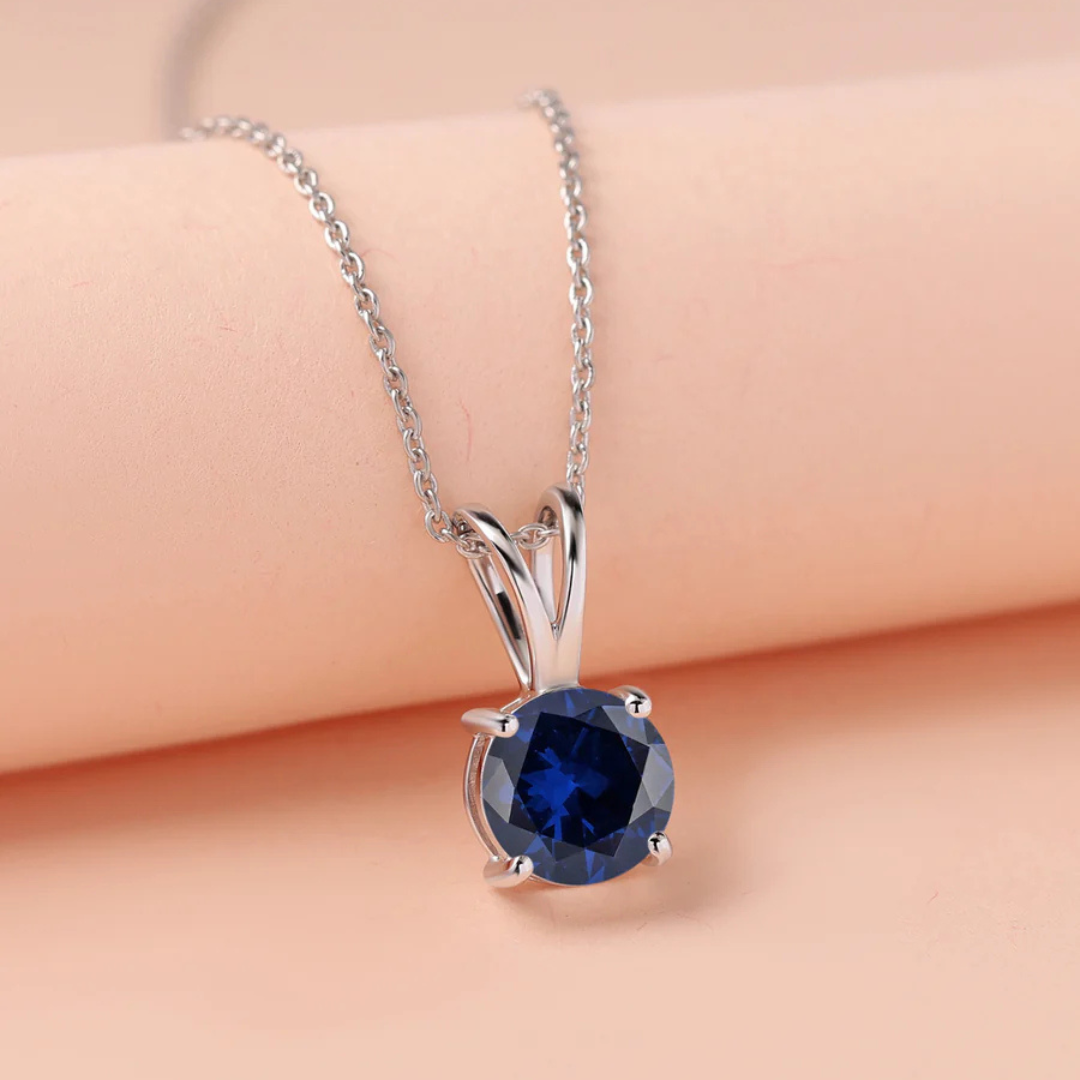 V-Bale Round Blue Sapphire Solitaire Pendant Without Chain in 10K/14K gold and platinum with certified lab-grown or natural diamonds