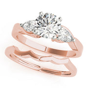 Round Diamond Trilogy Engagement Ring in 10K/14K gold and platinum with certified lab-grown or natural diamonds