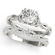 Regal With Twisted Shank Round Diamond Engagement Ring in 10K/14K gold and platinum with certified lab-grown or natural diamonds