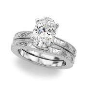 Sophisticated Sidestone Round Diamond Engagement Ring in 10K/14K gold and platinum with certified lab-grown or natural diamonds