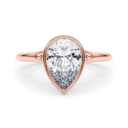 Noble Solitaire Ps Bezel Set Pear Diamond Engagement Ring in 10K/14K gold and platinum with certified lab-grown or natural diamonds
