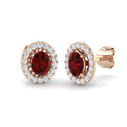 Ruby Halo Diamond Stud Earrings with Oval Cut Ruby in 10K/14K gold and platinum with certified lab-grown or natural diamonds