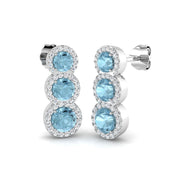 Graduated Aquamarine Halo Stud Earrings in 10K/14K gold and platinum with certified lab-grown or natural diamonds