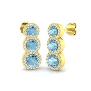 Graduated Aquamarine Halo Stud Earrings in 10K/14K gold and platinum with certified lab-grown or natural diamonds
