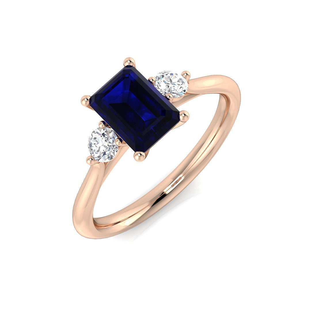 Emerald Cut Blue Sapphire Three Stone Ring in 10K/14K gold and platinum with certified lab-grown or natural diamonds