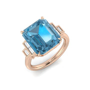 Emerald Cut Blue Topaz Solitaire Ring with Side Baguette Diamonds in 10K/14K gold and platinum with certified lab-grown or natural diamonds