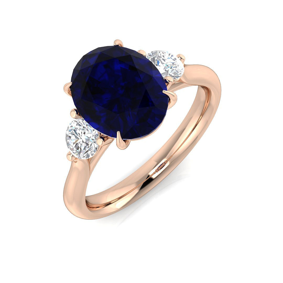 Oval Cut Blue Sapphire Side Stone Ring with Natural Round Side Stones in 10K/14K gold and platinum with certified lab-grown or natural diamonds