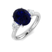 Oval Cut Blue Sapphire Side Stone Ring with Natural Round Side Stones in 10K/14K gold and platinum with certified lab-grown or natural diamonds