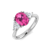 Platinum Oval Cut Pink Sapphire Ring with Natural Trillion Diamond Side Stones in 10K/14K gold and platinum with certified lab-grown or natural diamonds