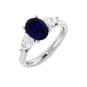 Blue Sapphire Three Stone Ring with Pear Diamond Side Stones in 10K/14K gold and platinum with certified lab-grown or natural diamonds