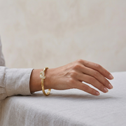 Natural Round Cut Diamond Cluster Knot Fancy Bangle with Hinged Lock in 10K/14K gold and platinum with certified lab-grown or natural diamonds