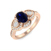 Oval Blue Sapphire Three Stone Ring with Pear Diamond Halo Accents in 10K/14K gold and platinum with certified lab-grown or natural diamonds