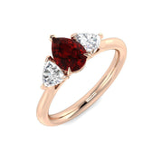 Ruby Trilogy Ring with Pear Cut Ruby & Trillion Diamond Side Stones in 10K/14K gold and platinum with certified lab-grown or natural diamonds