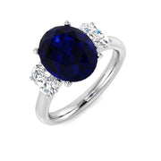 Natural Oval Cut Blue Sapphire with Side Stone Ring in Prong Set in 10K/14K gold and platinum with certified lab-grown or natural diamonds