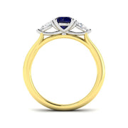 Round Blue Sapphire Three Stone Ring in 10K/14K gold and platinum with certified lab-grown or natural diamonds
