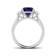 Natural Oval Cut Blue Sapphire with Side Stone Ring in Prong Set in 10K/14K gold and platinum with certified lab-grown or natural diamonds
