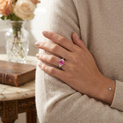 Platinum Oval Cut Pink Sapphire Ring with Natural Trillion Diamond Side Stones in 10K/14K gold and platinum with certified lab-grown or natural diamonds